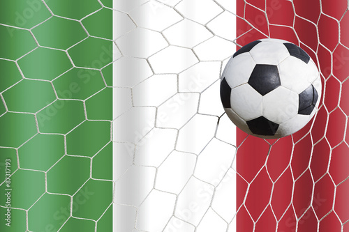 Italy waving flag and soccer ball in goal net