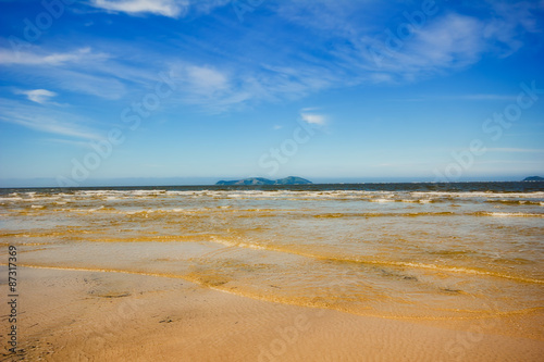 Ilha Comprida beach, São Paulo - Brazil. Waves in a sunny day at the end of brazilian island.