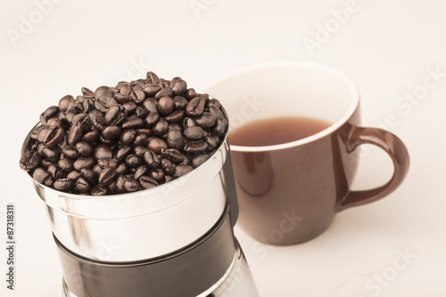 Coffee beans in coffe grinder