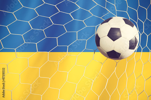 Soccer Background with Ukraine Flag vintage color © FAMILY STOCK