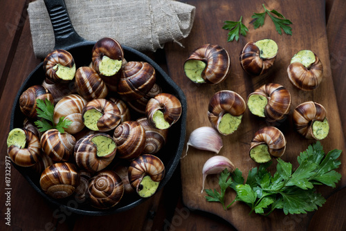 Fototapeta Naklejka Na Ścianę i Meble -  Above view of unprepared bourgogne snails with garlic butter