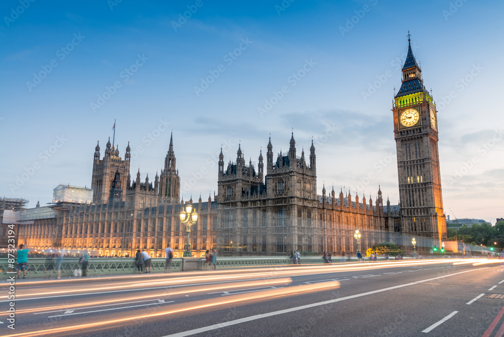 London night view from Westminster Bridge. Big Ben and city traf