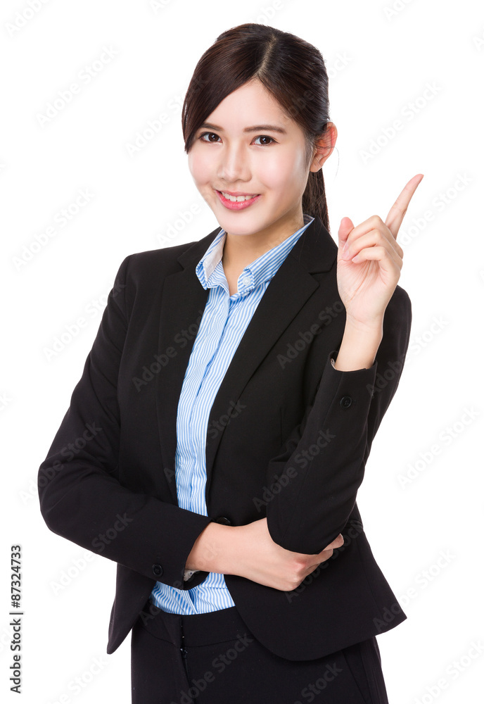 Young businesswoman with finger point up Young businesswoman with finger point up