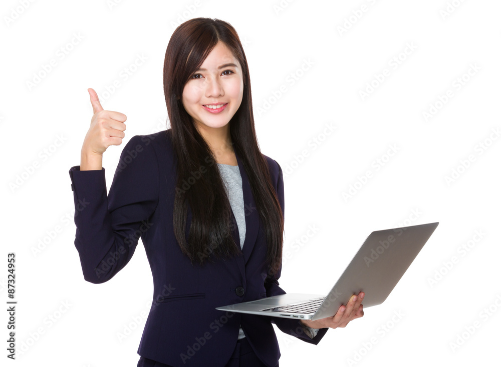 Young businesswoman use of the laptop computer and finger point Young businesswoman use of the laptop computer and finger point