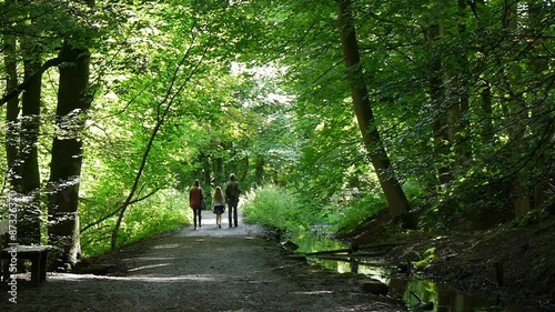 Skipton, North Yorkshire, United Kingdom. People enjoy walk through Skipton Castle Woods.