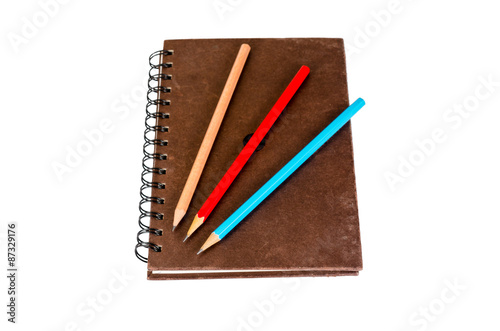 Notebook with pencil isolated on white background