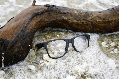 eyeglasses on the sand
