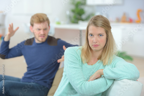 Couple arguing on the sofa