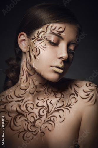 Woman with creative ornament makeup