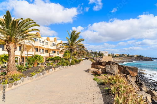 Hotel buildings along coastal promenade in Playa Blanca holiday resort town  Lanzarote island  Spain