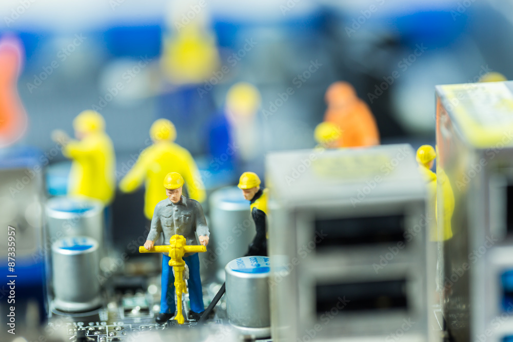 Obraz premium Team of engineers repairing circuit mother board