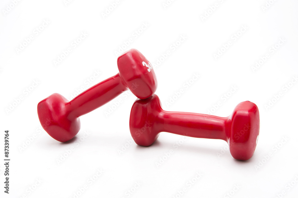 Red rubber dumbbell on white background. Red rubber dumbbell on white background.