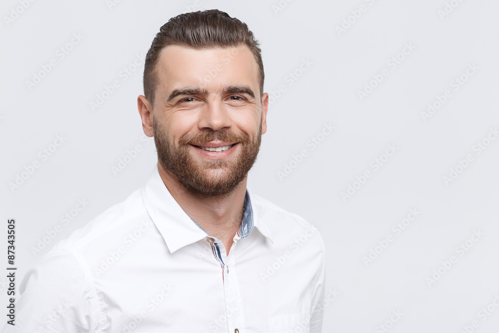 Close-up of smiling man on isolated background Close-up of smiling man on isolated background
