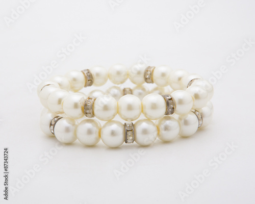 Pearl bracelet of white on a white background