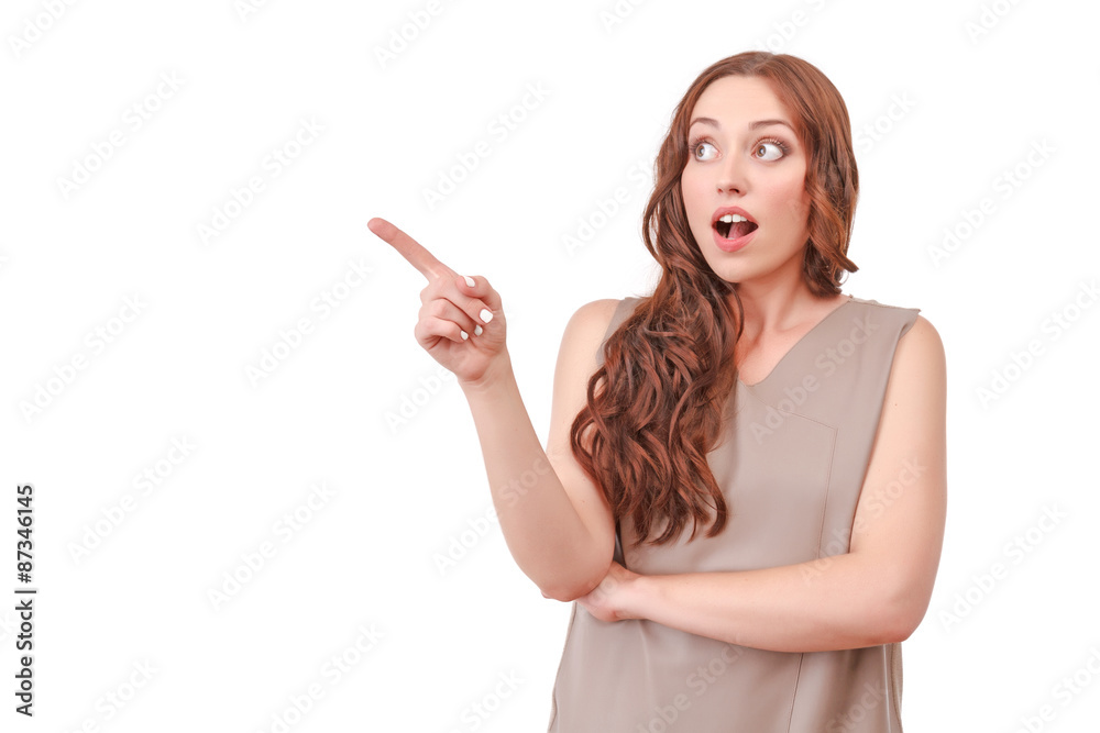 Red-haired woman pointing with index finger Red-haired woman pointing with index finger