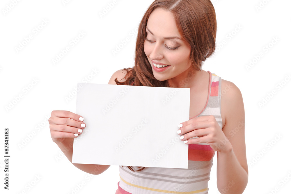 Pretty red-haired woman holding paper board Pretty red-haired woman holding paper board