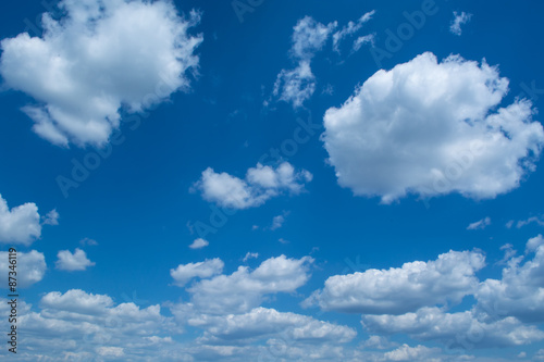 Blue sky with curly clouds © beletskaya18