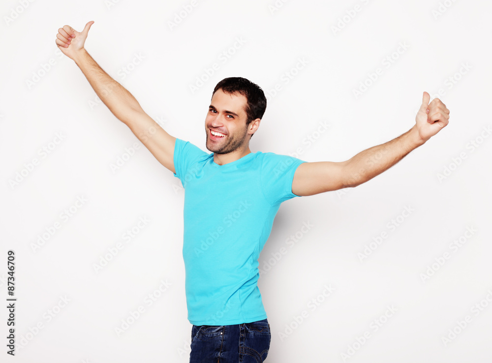 man with both hands raised in the air. 