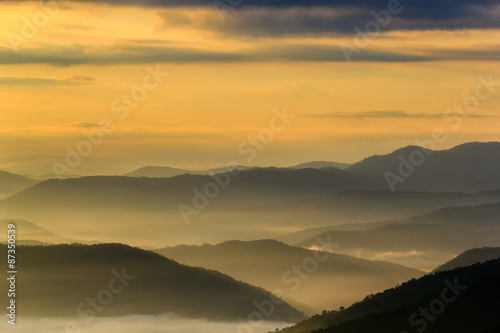 Layer of mountains in the mist at sunrise time, Sri Nan National Park, Nan Province, Thailand