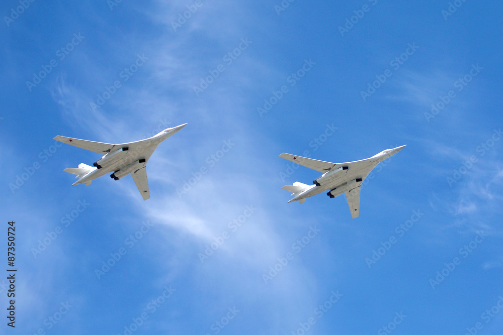 White Swans. Russian military aircraft supersonic bombers with variable sweep wing Tu-160 in flight White Swans. Russian military aircraft supersonic bombers with variable sweep wing Tu-160 in flight