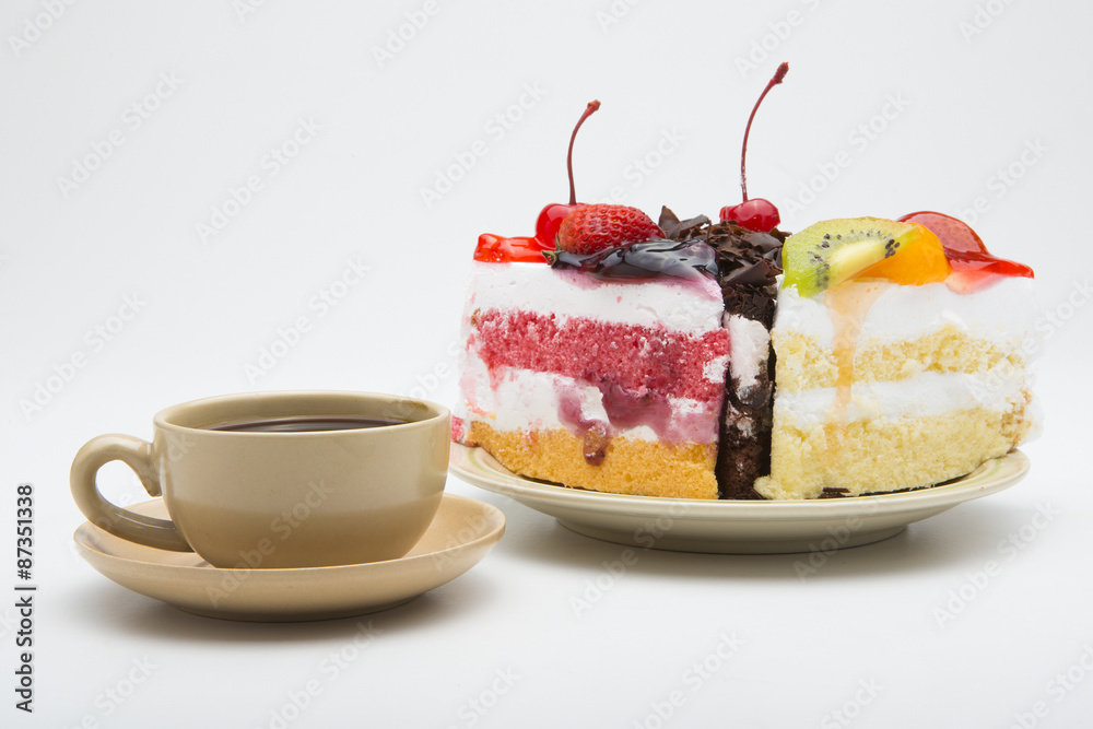 cup of coffee and delicious cake on white background