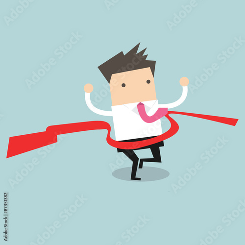Businessman crossing finish line, he is won a competition