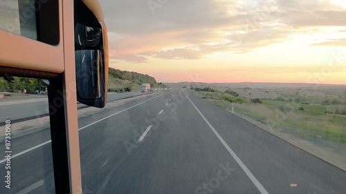 View from the cabin of the bus, on the sunset