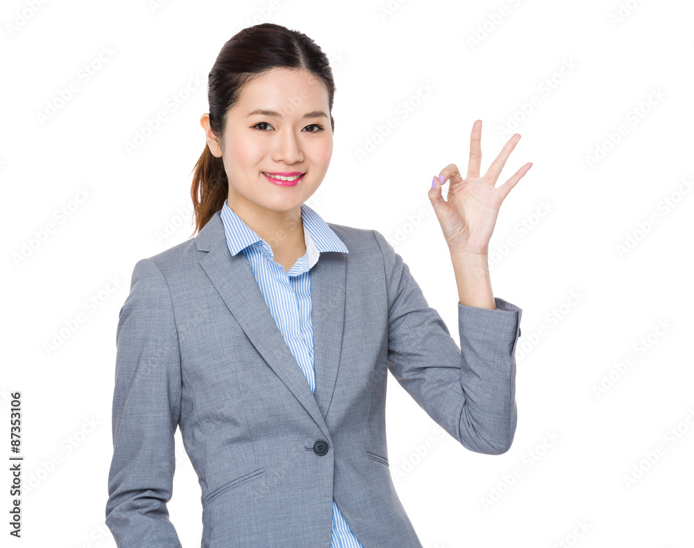 Businesswoman with ok sign gesture Businesswoman with ok sign gesture