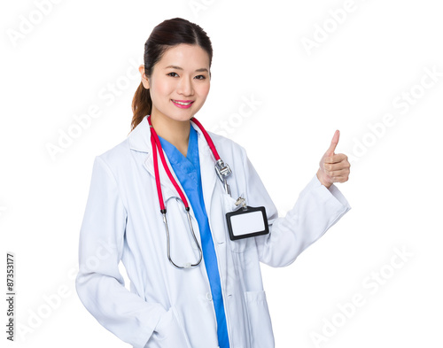 Doctor woman with thumb up gesture