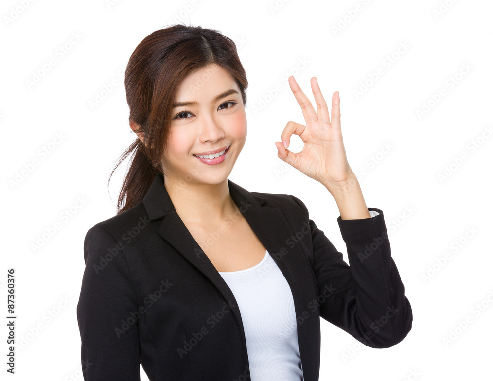 Asian businesswoman with ok sign gesture Asian businesswoman with ok sign gesture