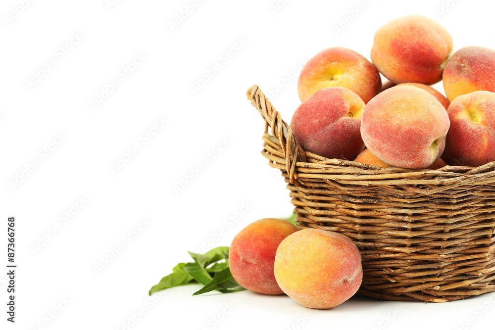 Fresh peach fruit in basket on a white background Fresh peach fruit in basket on a white background