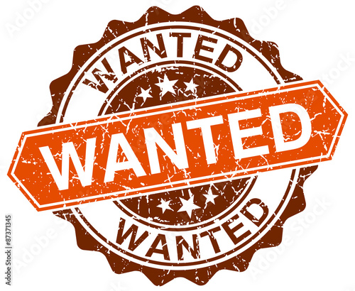 wanted orange round grunge stamp on white