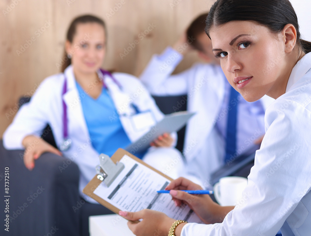 Happy medical team discussing and working together Happy medical team discussing and working together