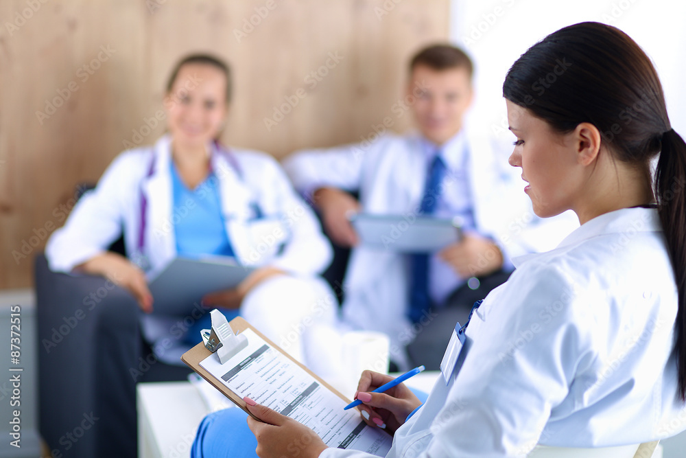 Happy medical team discussing and working together Happy medical team discussing and working together