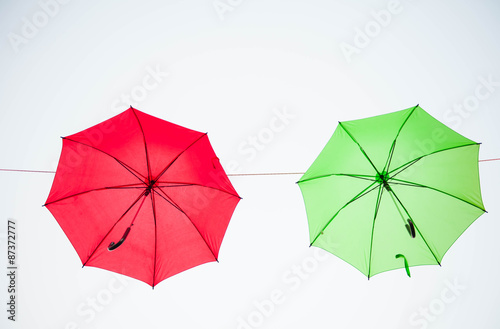 Streets are decorated with colorful umbrellas.  