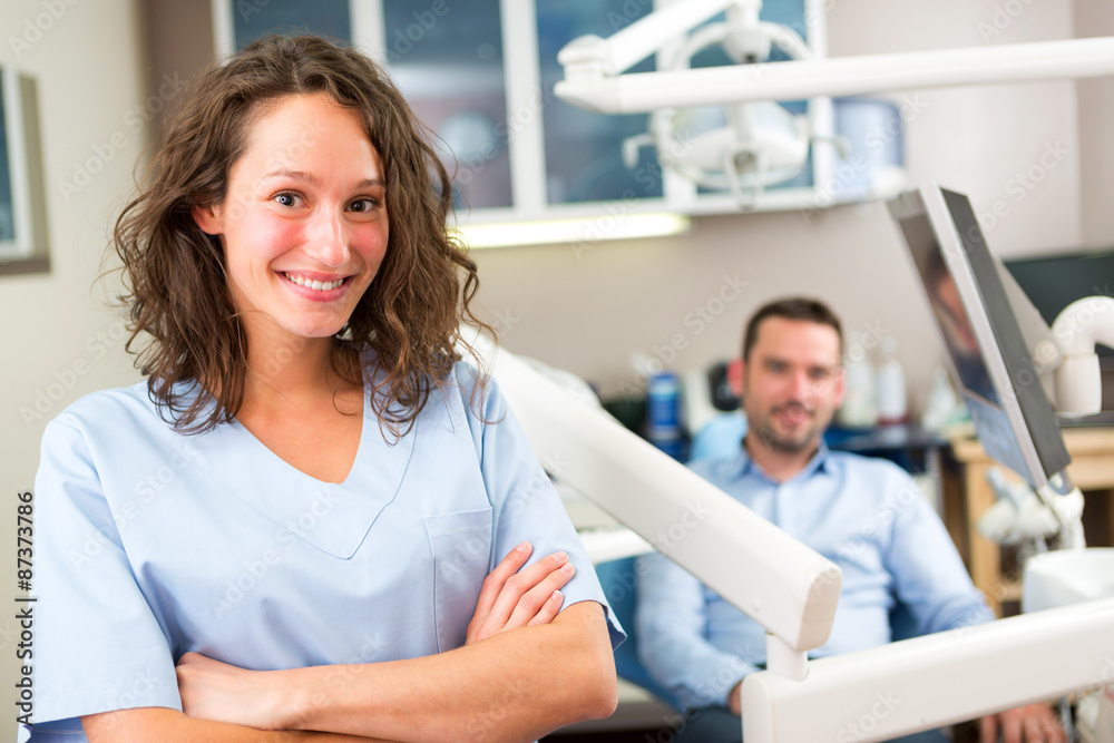 Obraz premium Portrait of a young attractive dentist in his office