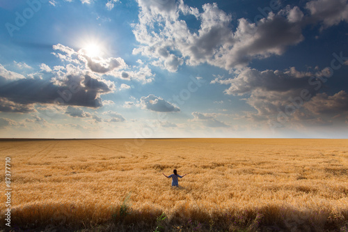 Girl among a field of wheat © danmir12