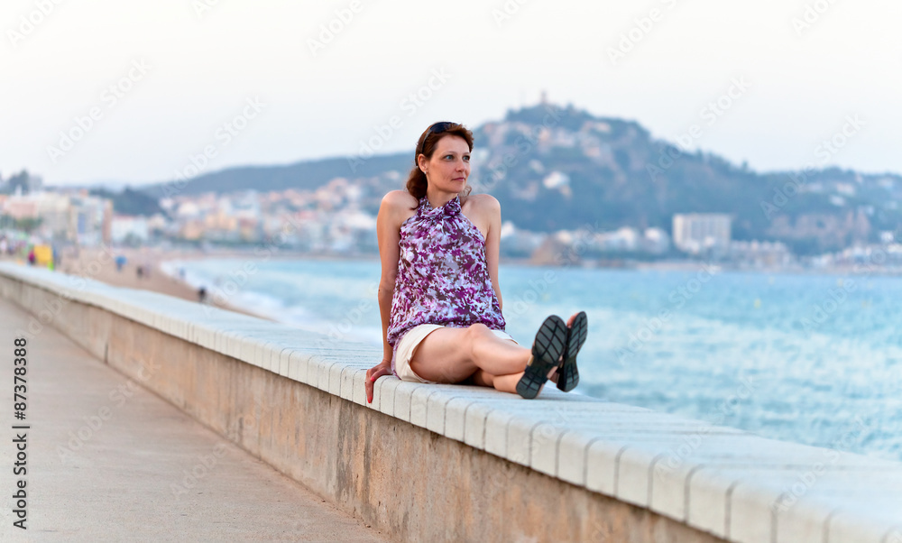 middle age woman on a quay