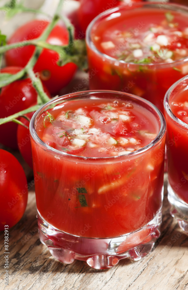 Traditional tomato soup gazpacho in a glass, selective focus Traditional tomato soup gazpacho in a glass, selective focus