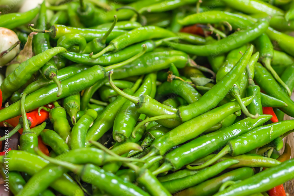 Heap of green Cayenne pepper (Capsicum annuum) for sale