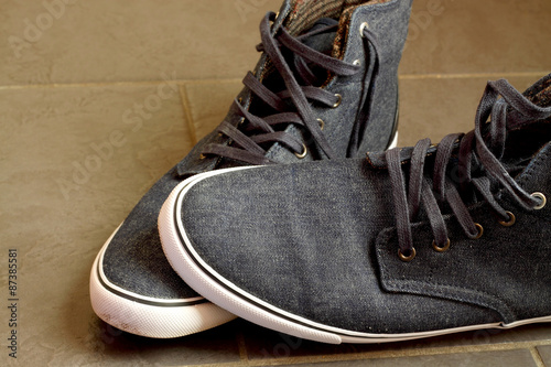 Canvas shoes. Pair of blue canvas shoes with rubber sole.