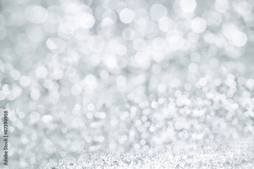 Abstract bokeh lighting background , silver color tone Abstract bokeh lighting background , silver color tone