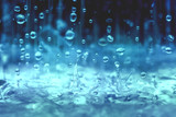 close up rain water drop falling to the floor in rainy season 