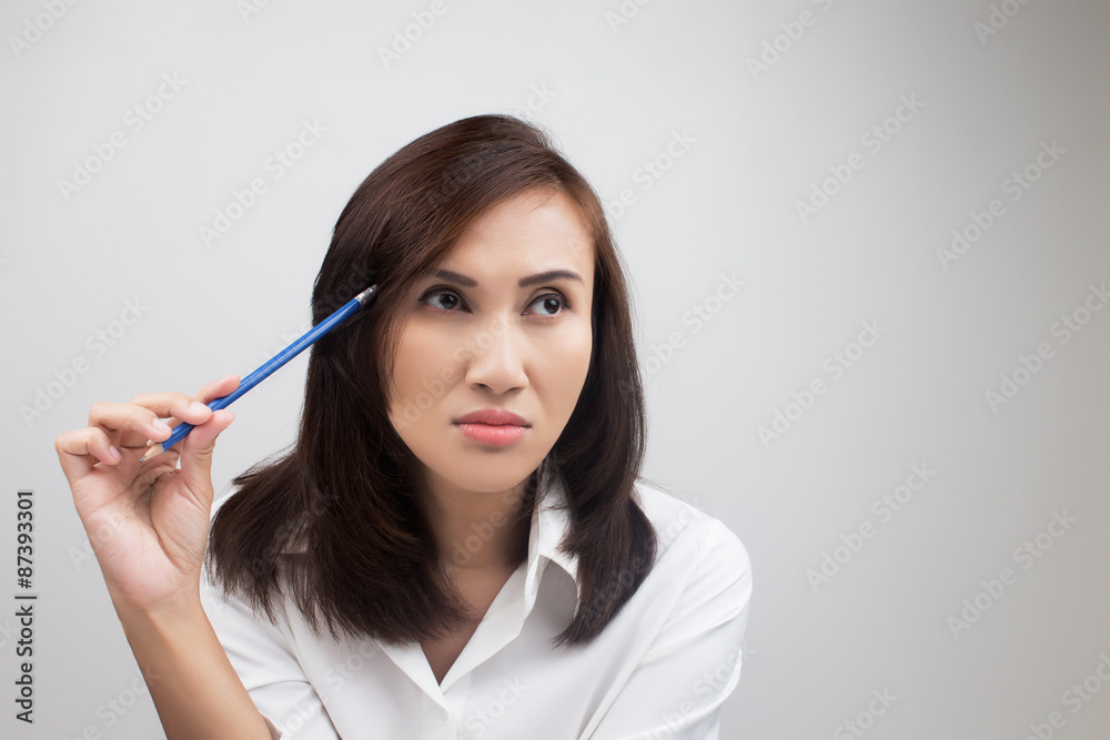 Businesswoman thinking about an idea Businesswoman thinking about an idea