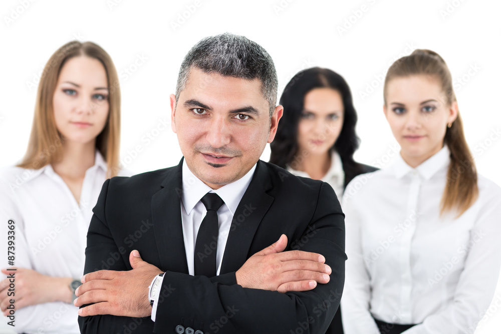 Businessman standing in front of his colleagues Businessman standing in front of his colleagues