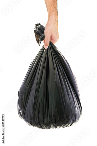 Asian man hand holding a garbage bag.