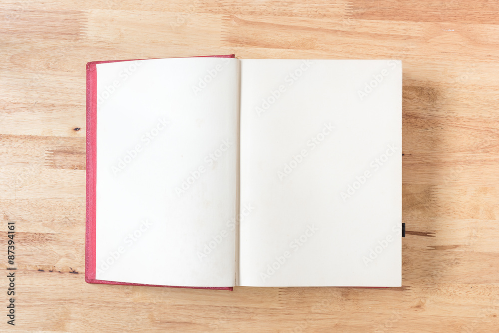 open old book on wood background open old book on wood background