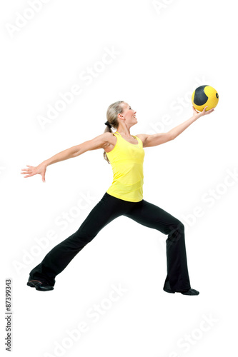Fitness with ball: young woman doing exercises
