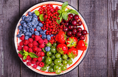 Set of summer berries on a wooden background