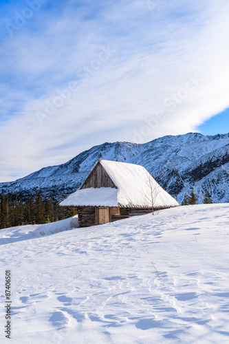 Wooden mountain hut in winter landscape of Gasienicowa valley, Tatra Mountains, Poland © pkazmierczak